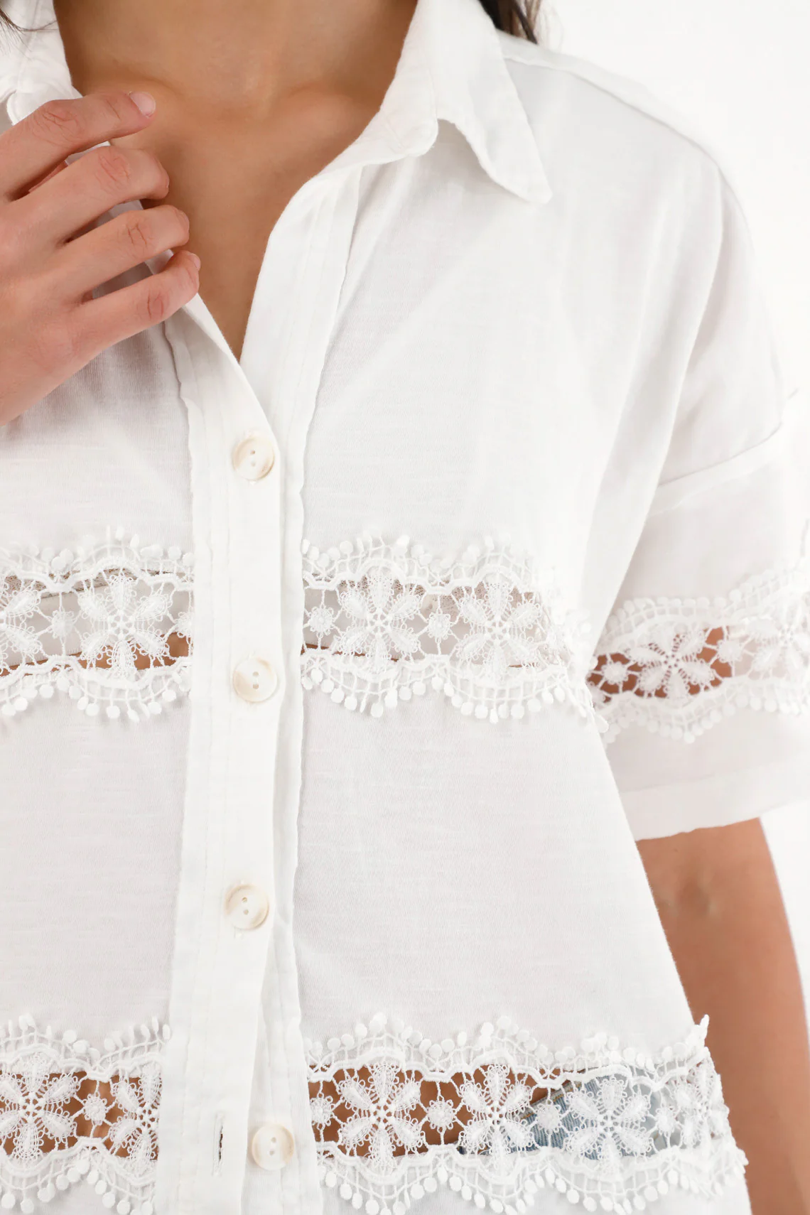 Women's short sleeve shirt with decorative cutouts. - Image 3