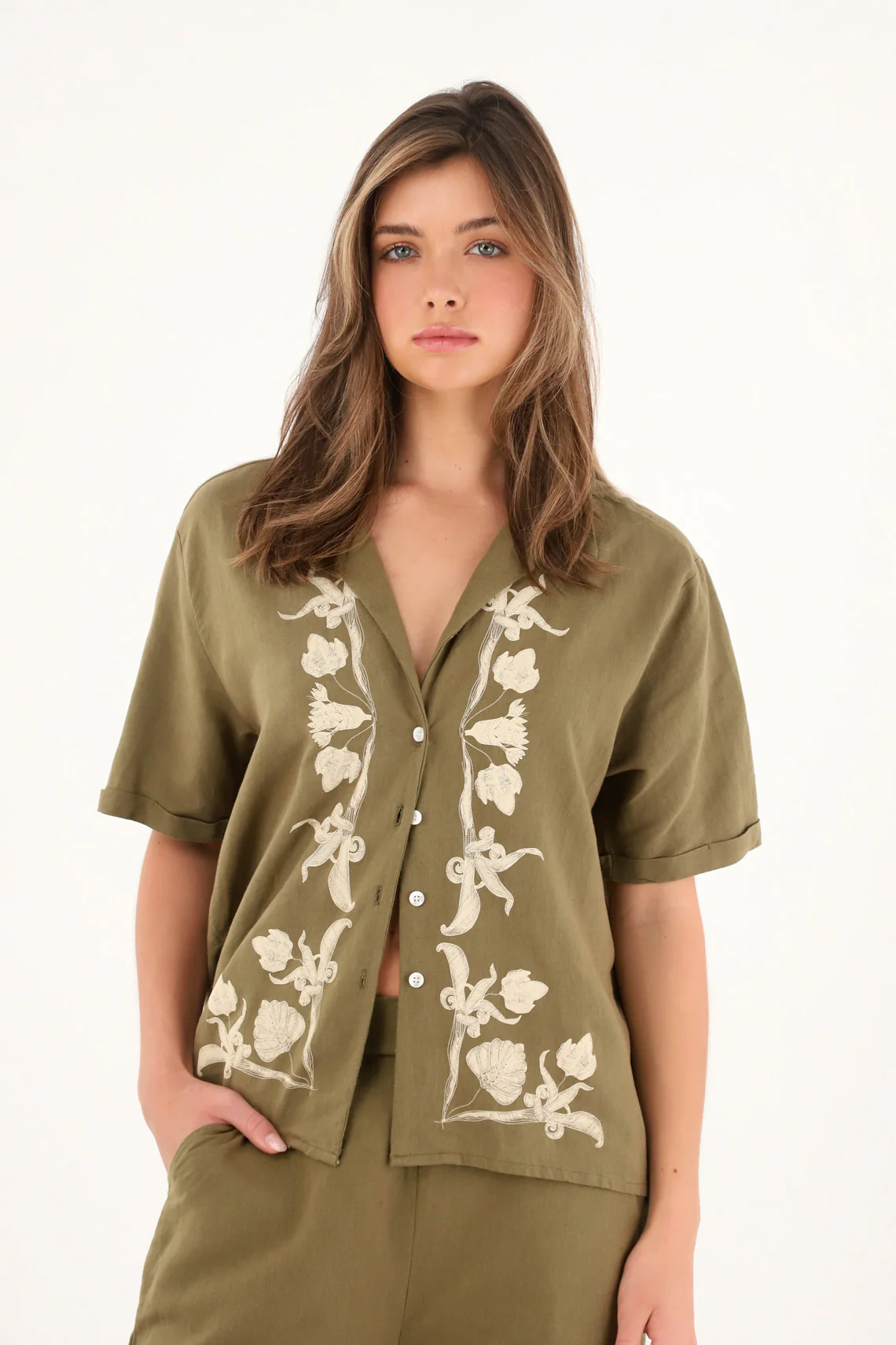 Women's bowling shirt with embroidered detailing.